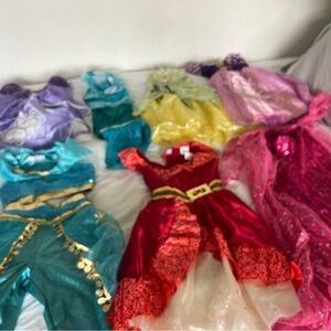 12 girls princess costumes, wands, wigs, gloves. heavily loved & brand new